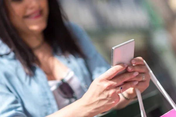 Young pretty woman using mobil phone