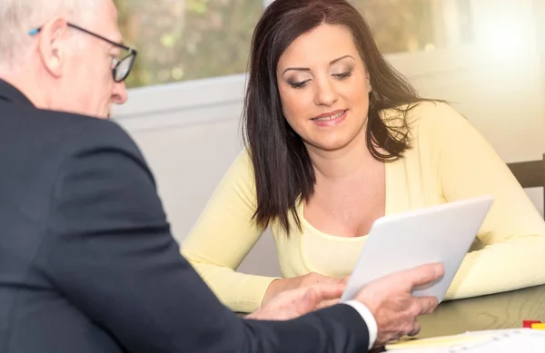 Woman meeting financial adviser in office, light effect — Stock Photo, Image