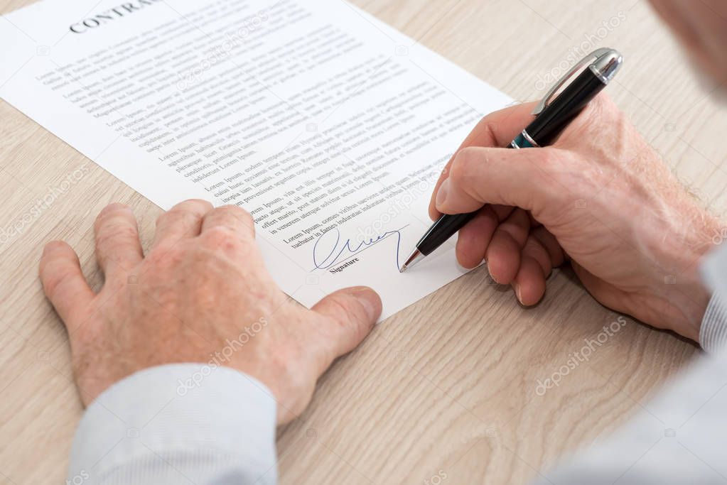 Man signing a contract