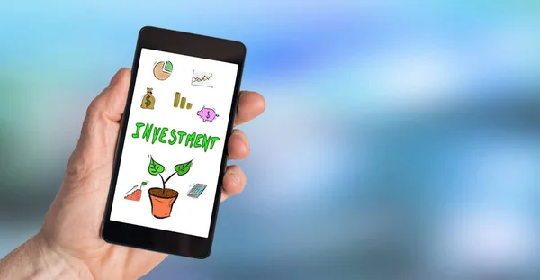 Investeringar koncept på en smartphone — Stockfoto