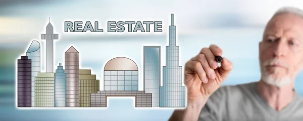 Man drawing real estate concept — Stock Photo, Image