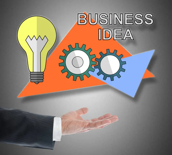 Business idee concept zweven boven een hand — Stockfoto