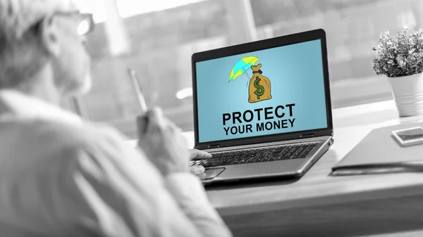 Money protection concept on a laptop screen