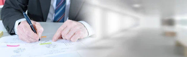 Businessman taking notes; panoramic banner