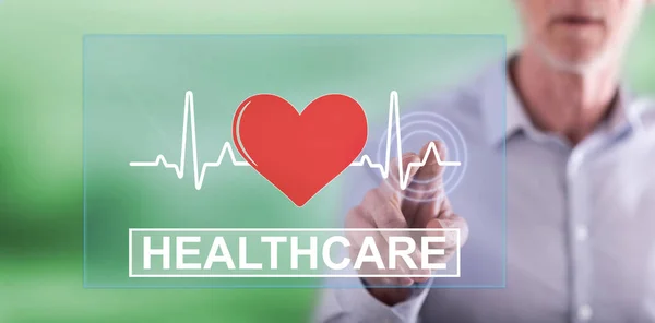 Man touching a healthcare concept — Stock Photo, Image