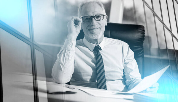 Portrait of mature businessman; multiple exposure