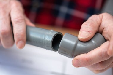 Plumber joining pvc pipes