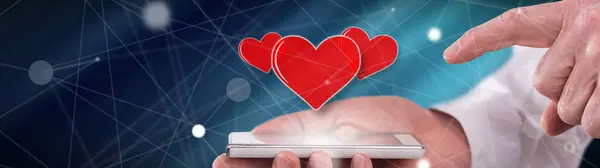 Koncepcja Miłości Nad Smartfonem Utrzymywane Przez Człowieka — Zdjęcie stockowe
