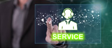 Bir adam dokunmatik ekranda bir servis konseptine parmağıyla dokunuyor.