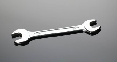 Gri arka planda otomatik mekanik araçlar, düz yatıyordu. Metin için boşluk