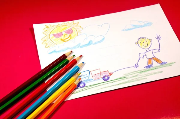 Red Background White Paper Which Picture Drawn Nearby Colored Pencils — Stock Photo, Image