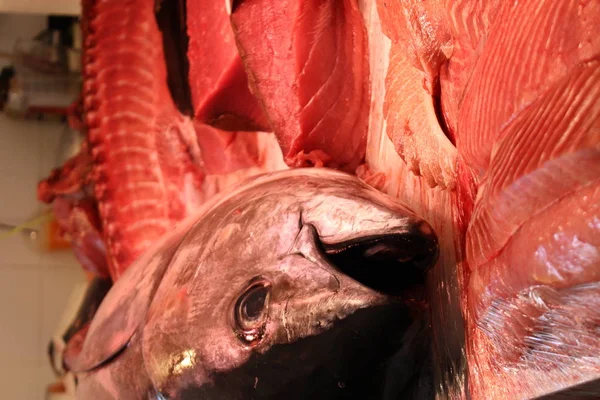 Fresh tuna fish and chopped tuna fillet on the fish market counter.