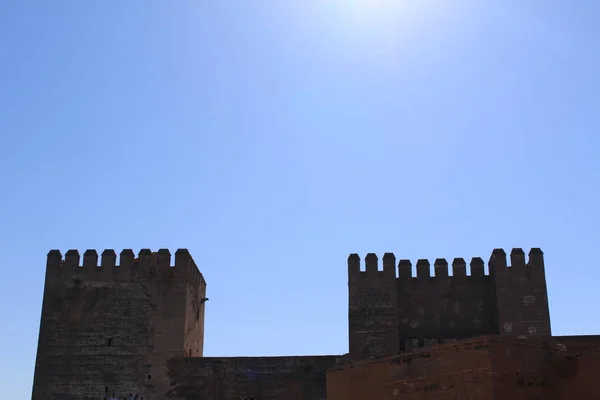 Watch and arms towers of Alcazaba fortress at the historical Alhambra Palace complex in Granada, Andalusia, Spain.