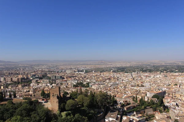 Aerial view of the Albaicin city taken from Watch Tower (Torre de la Vela) of the historical Alhambra Palace complex in Granada, Andalusia, Spain.