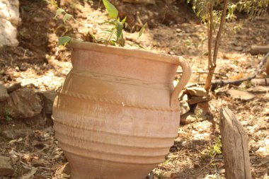 An amphora in Crete Island, Greece. It is an ancient Greek container which was used to carry wine in it. 