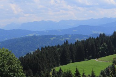 Beautiful green Alp mountains and hills from Pfaender Mountain in Bregenz, Vorarlberg, Austria.