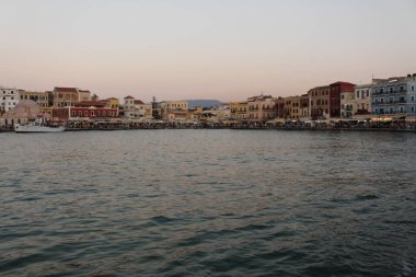 A view of old Venetian Harbor of Chania with historical buildings in Crete Island, Greece.