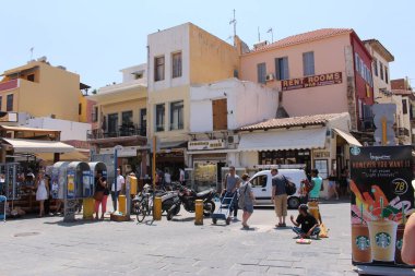 CHANIA, CRETE ISLAND, GREECE - JULY 30, 2016: A view of the old buildings in front of the Venetian Fountain at Pl. El. Venizelou street.