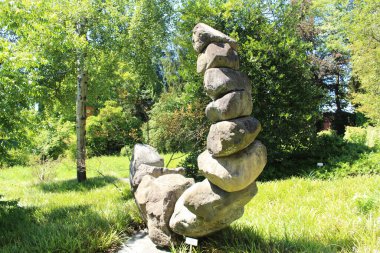 ST. GALLEN, SWITZERLAND - AUGUST 7, 2016: Abstract statue made of stones at St. Gallen Botanical Garden.