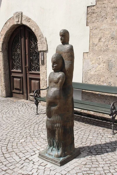 HALL IN TIROL, AUSTRIA - AUGUST 15: Bronze human sculptures on Raiffeisenplatz on August 15, 2015 in Hall in Tirol.
