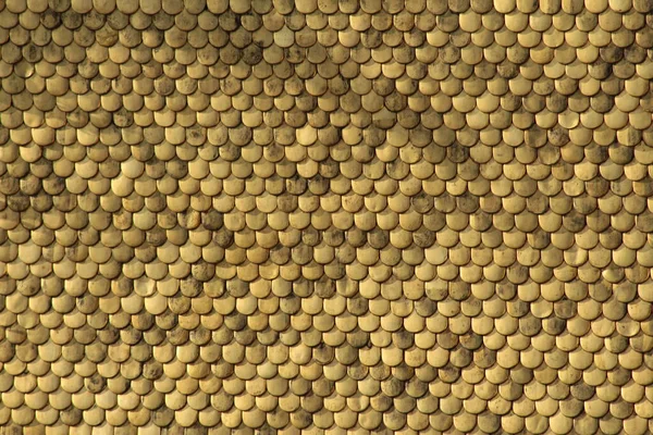 Aerial closeup view of tiles on Golden Roof (Goldenes Dachl) taken from the top of City Tower (Stadtturm, 51 meters). Golden Roof has 2,738 fire-gilded copper tiles.