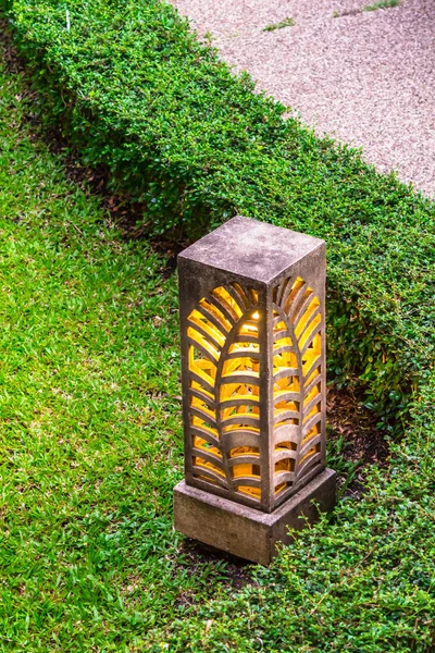 Carved stone lamp decoration in garden. — Stock Photo, Image