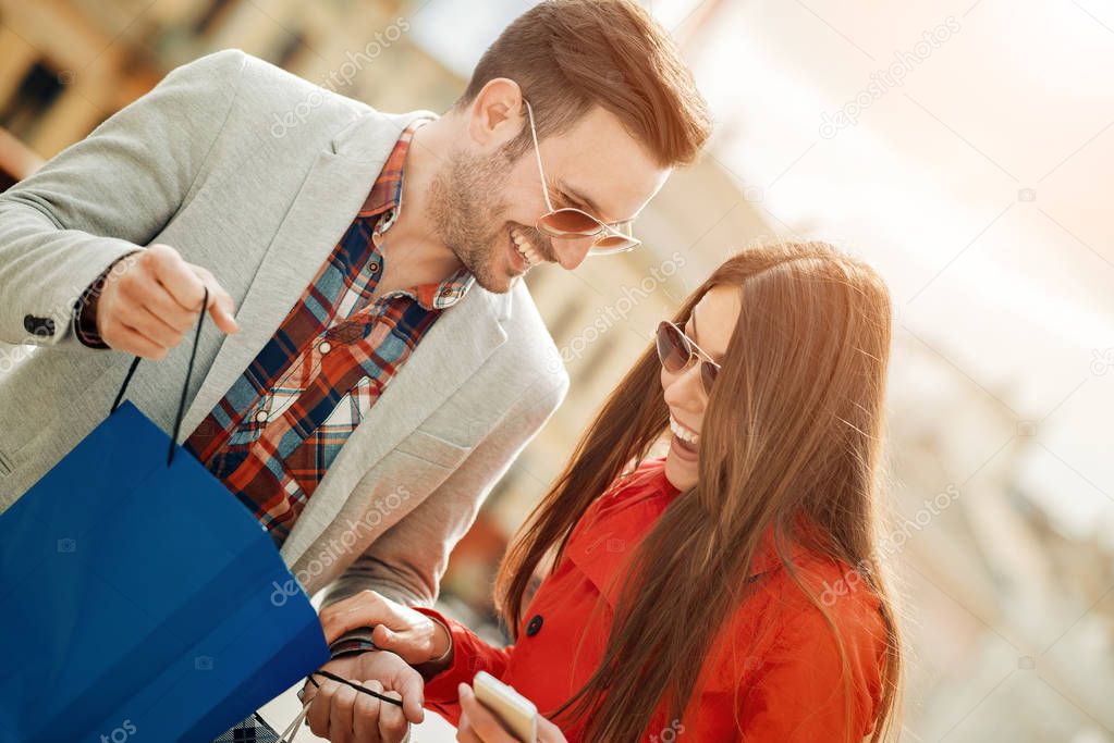 Couple looking at their shopping bags