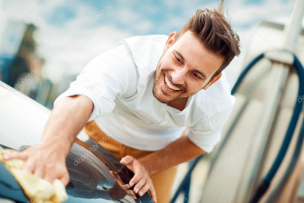 Man cleaning a car