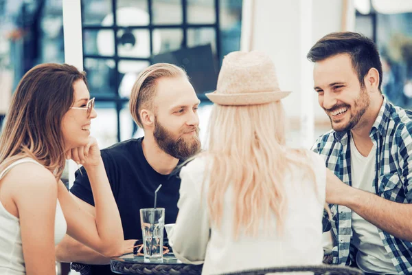Group of friends enjoying in cafe together — Stock Photo, Image