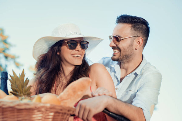 Young couple riding on the bicycle