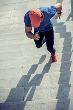Young man running on stairs clipart