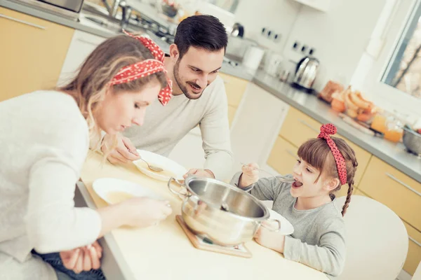 Young family in kitchen