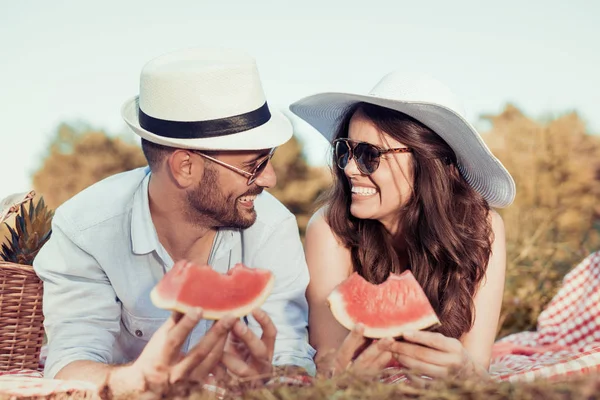 Young couple on picnic in the park — Stock Photo, Image