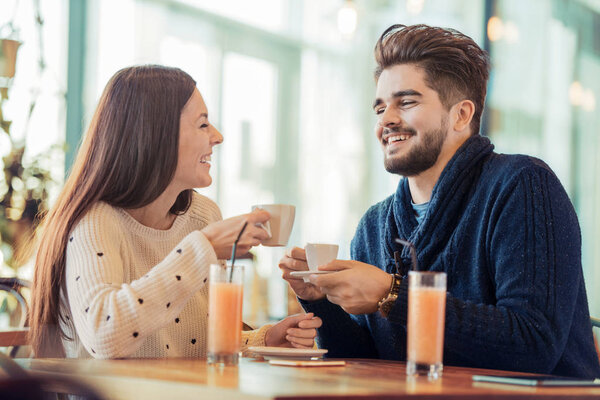 Young couple sitting in cafe 