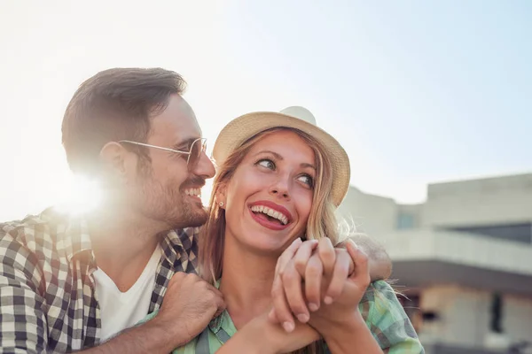 Cute couple in park on sunny day Stock Picture