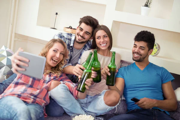 Group of people celebrating at home and having fun. — Stock Photo, Image