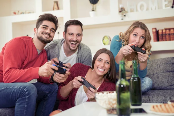 Friends having great time and  playing video game together. — Stock Photo, Image