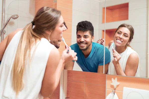 Man and woman together in bathroom. — Stock Photo, Image