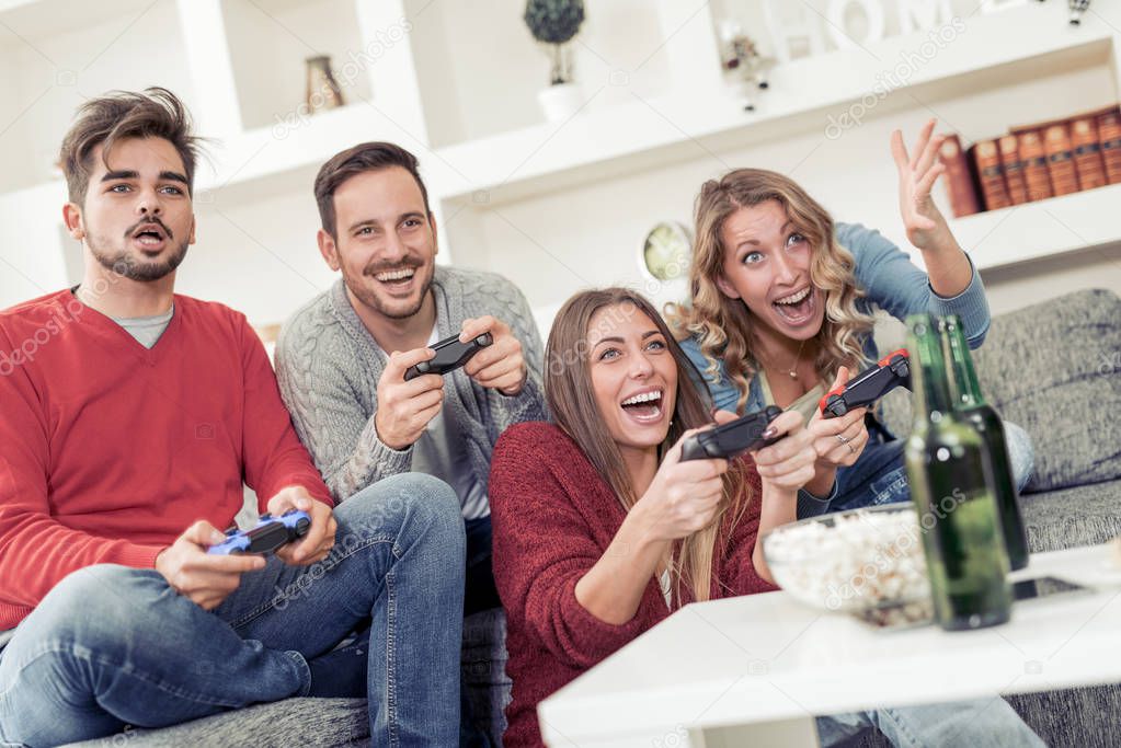 Group of friends playing video games together.