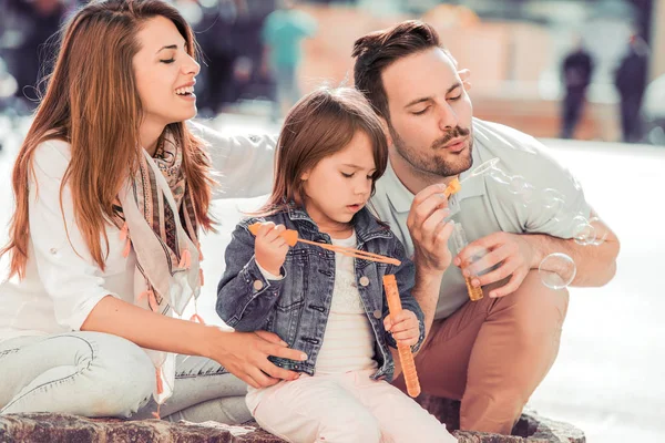 Happy family with child in park — Stock Photo, Image