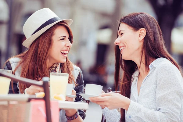 female friends with coffee at cafe