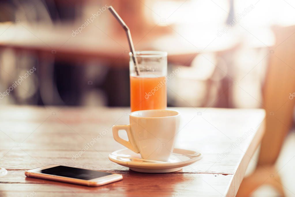 Coffee cup, juice and smartphone