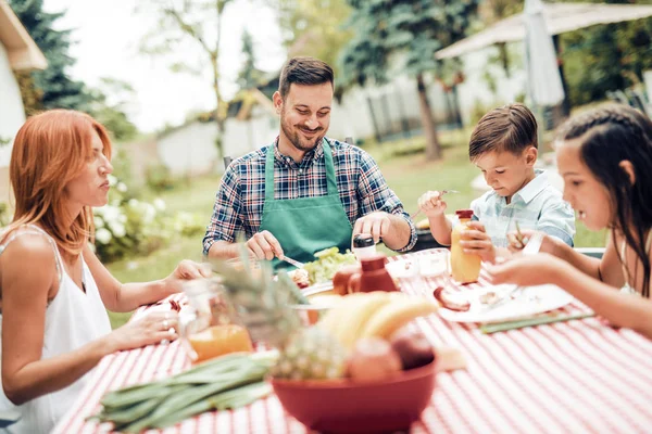Happy family having a lunch — Stock Photo, Image