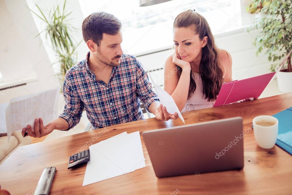 Couple calculating bills