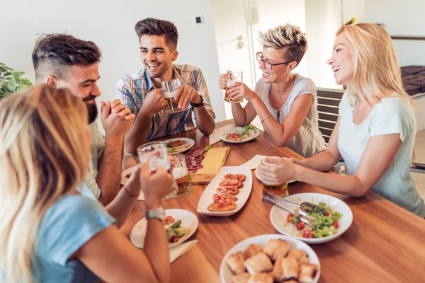 Friends having lunch together at home — Stock Photo, Image