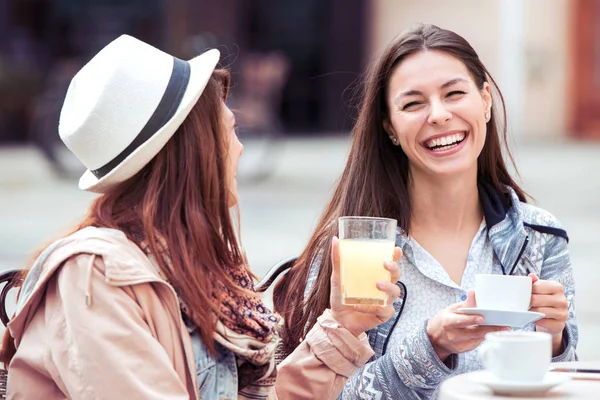 Two young woman having fun at the cafe. — Stock Photo, Image