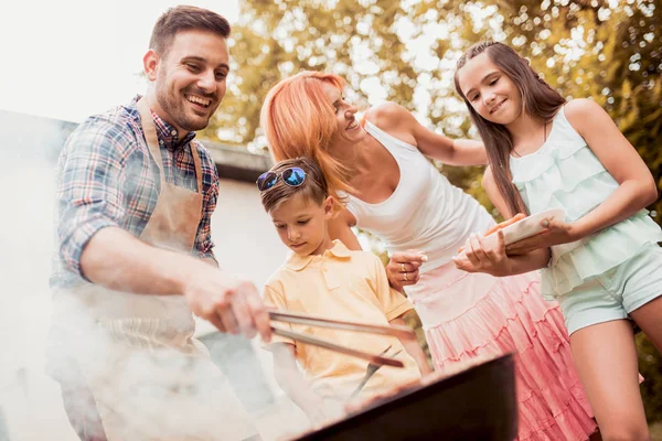 Family having a barbecue party. — Stock Photo, Image