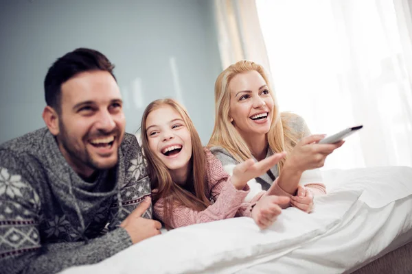 Family Watching Bedroom Laughing — Stock Photo, Image