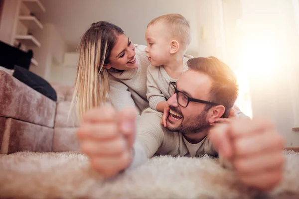 Happy Family Playing Home Having Fun Together — стоковое фото