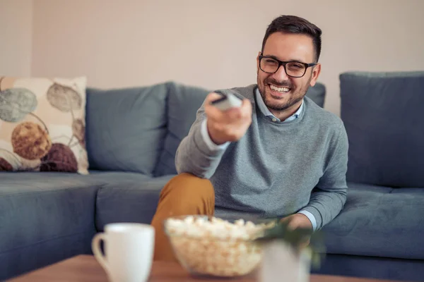 Young Man Watching Popcorn Sofa Home — Stock Photo, Image